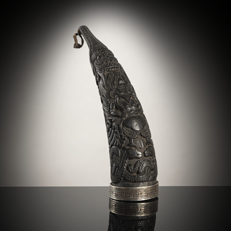 A FINE CARVED HORN MAGICAL POWDER CONTAINER