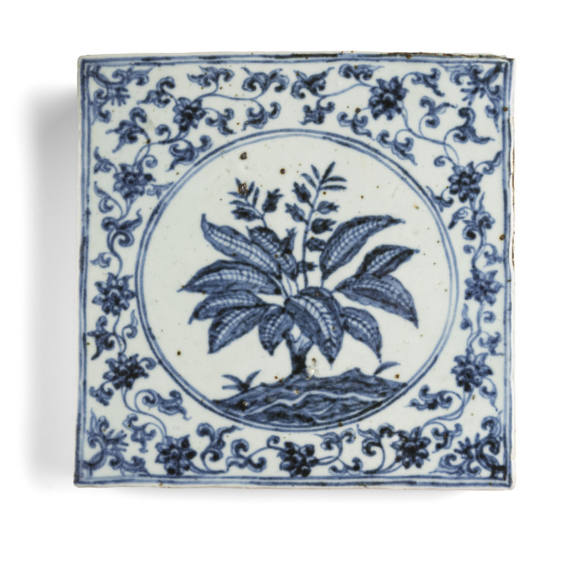 A porcelain tile decorated with a banana plant in underglaze blue