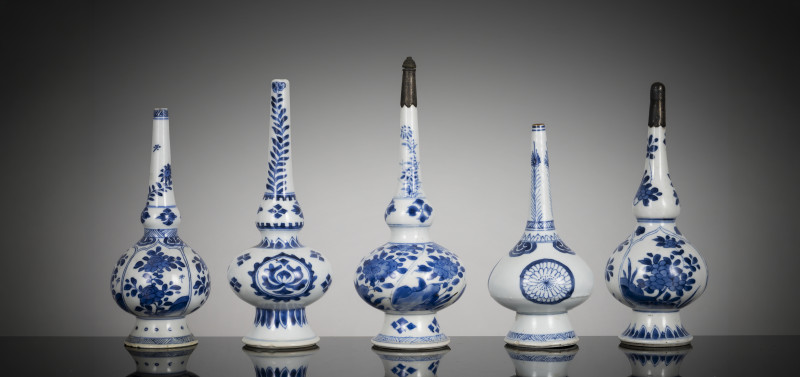 Five porcelain rosewater bottles decorated in underglaze blue, two with mounts at the mouth