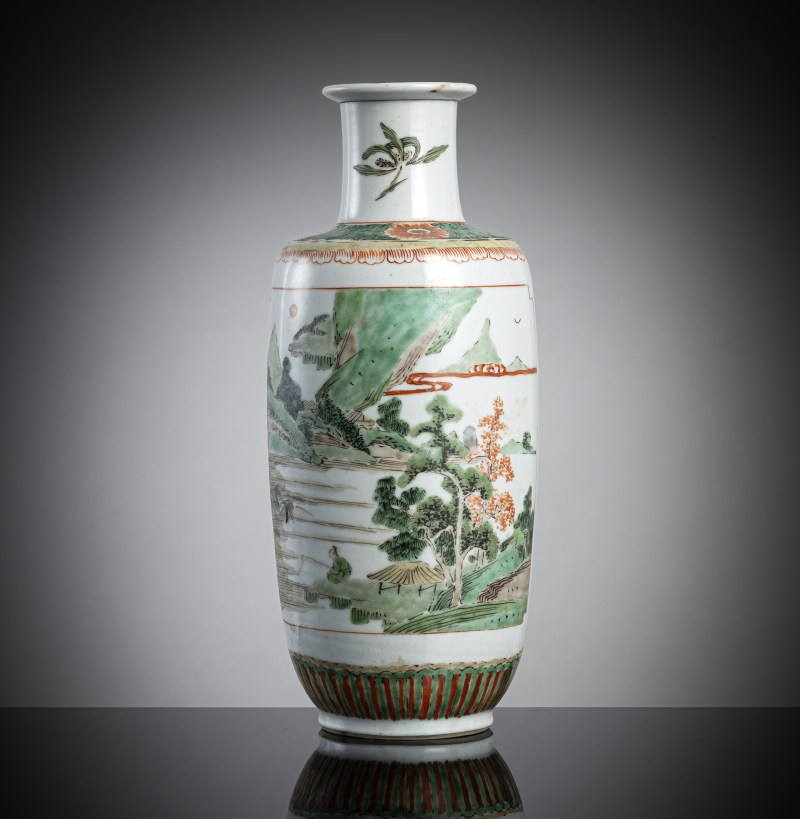 A 'Famille verte' porcelain rouleau vase with bird and landscape decoration