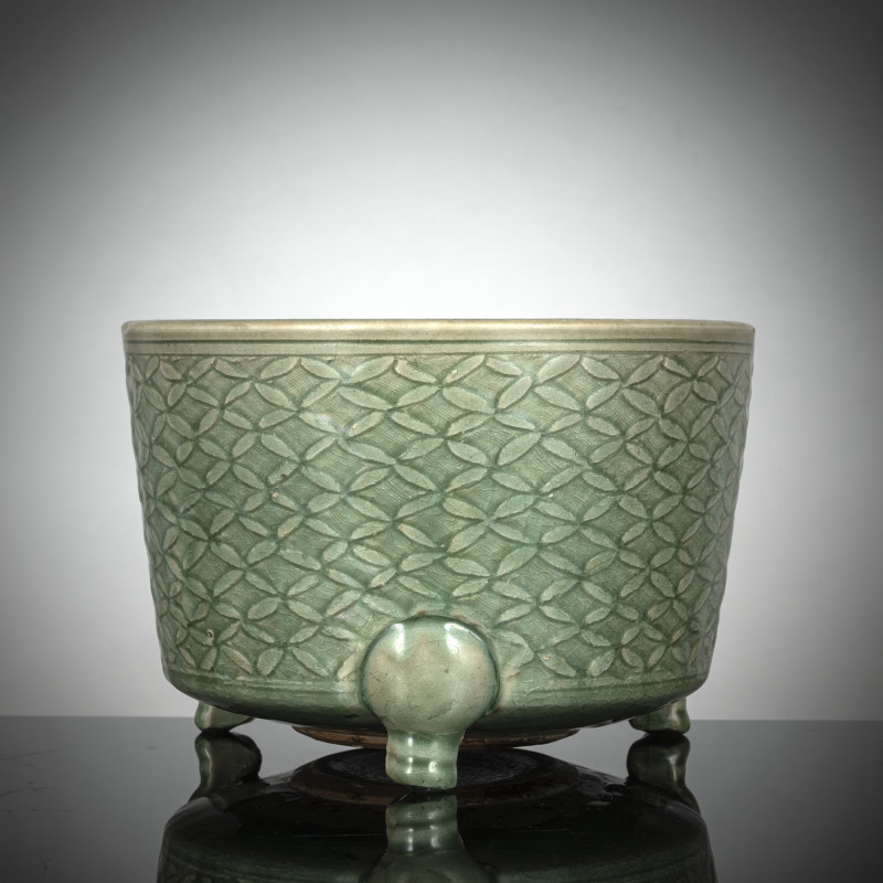 An incense burner with cash pattern and celadon glaze