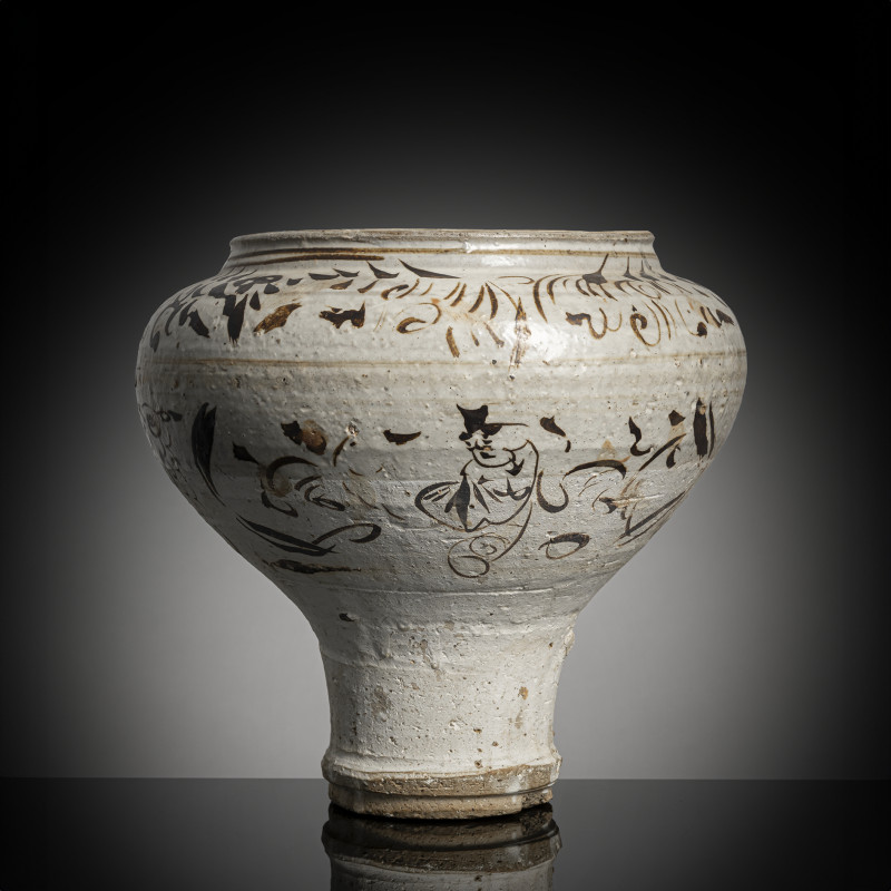 A Cizhou jar with figure decoration and a stylised inscription in Cizhou ware