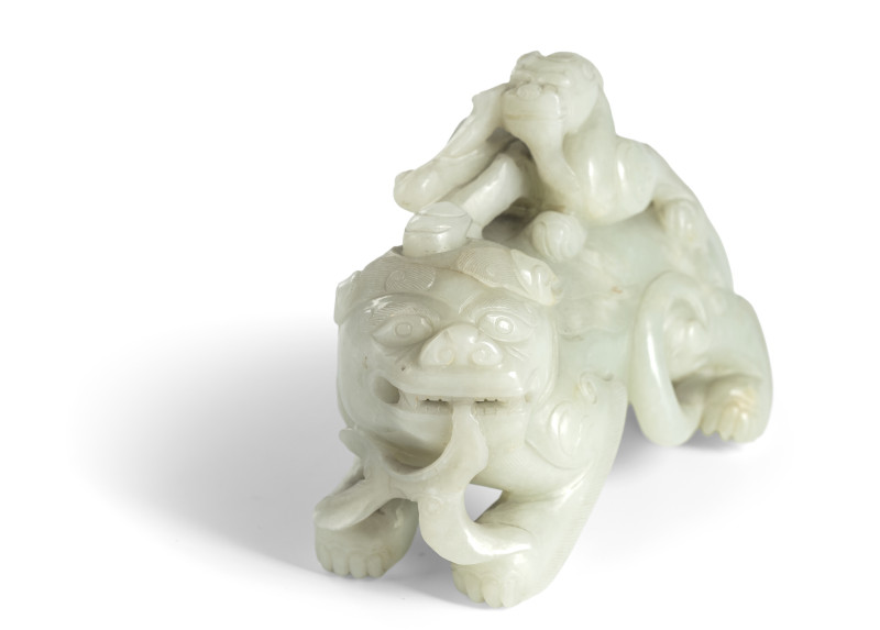 A fine jade carving of a 'bixie' with a boy in light green and white jade - 图2