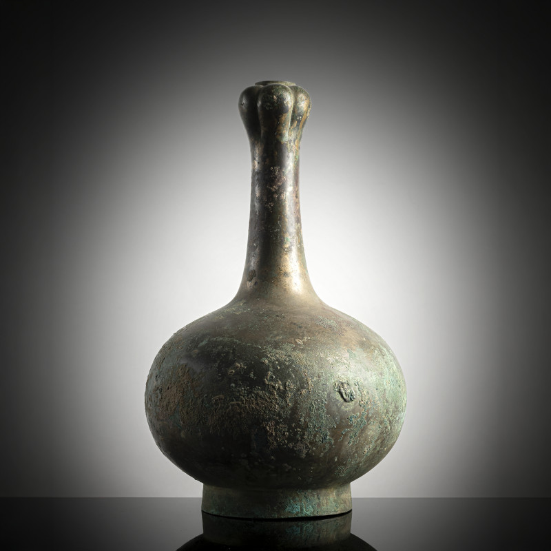A bronze "garlic head" bottle vase