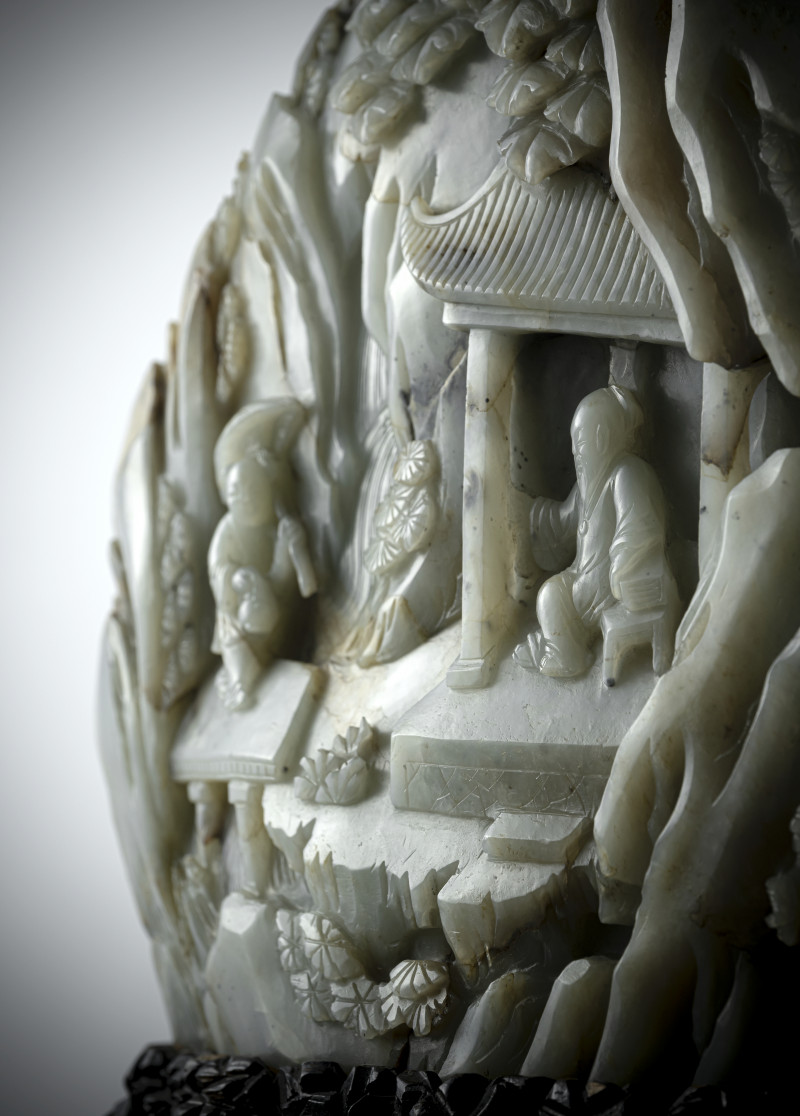 A large carved green jade boulder depicting scholars in a mountain landscape, mounted on a wooden stand - 图4