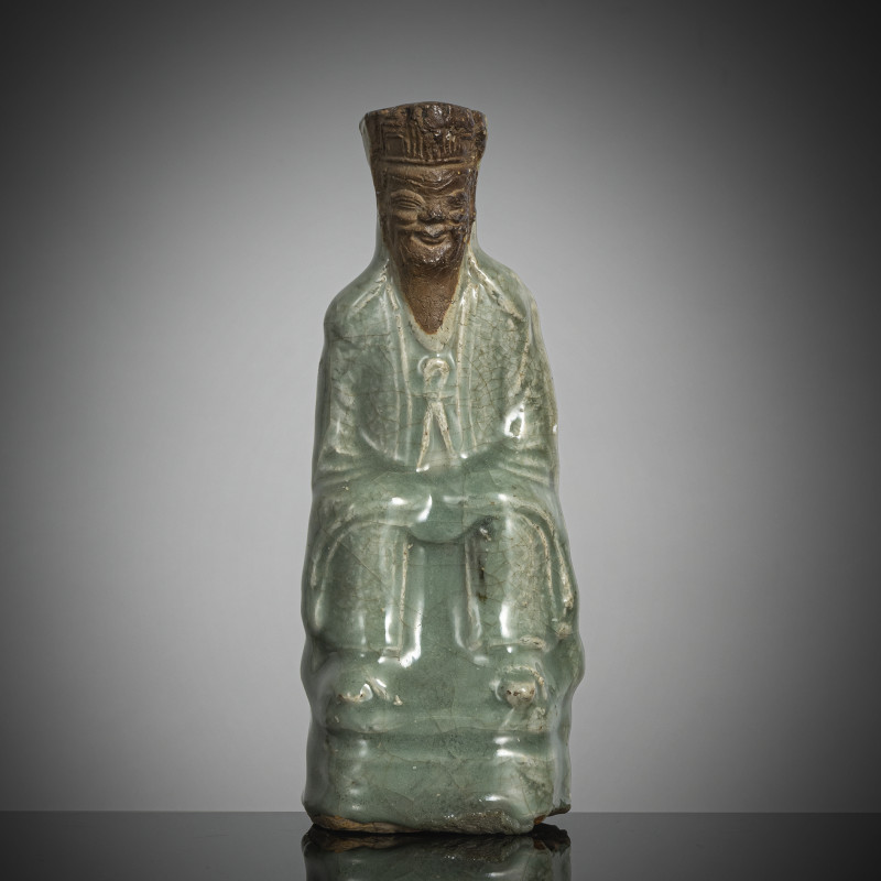 Longquan figure of a dignitary with celadon glaze