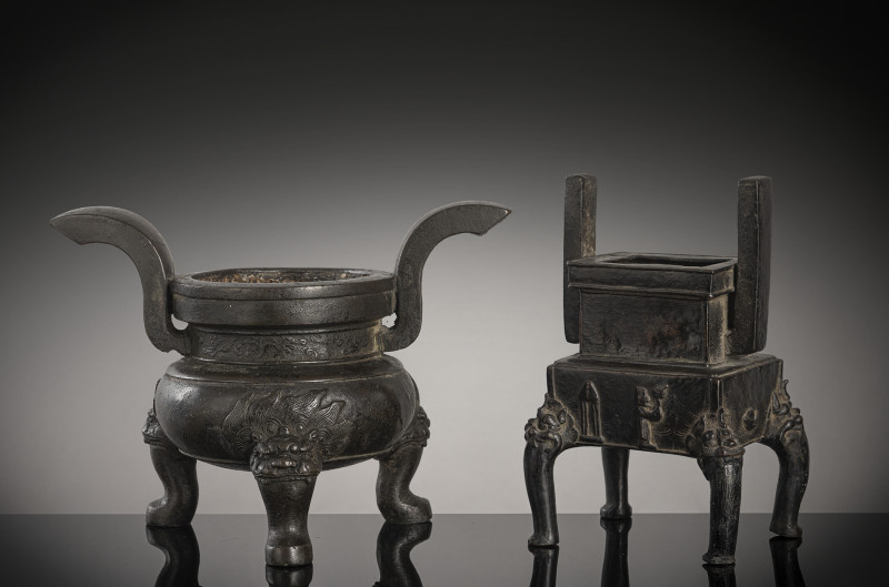 Two bronze incense burners, one on three legs, the second in the shape of a 'fang ding'