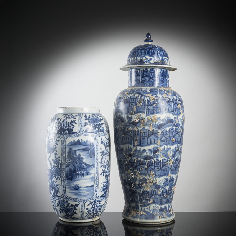 A large lidded blue and white porcelain vase and a smaller vase
