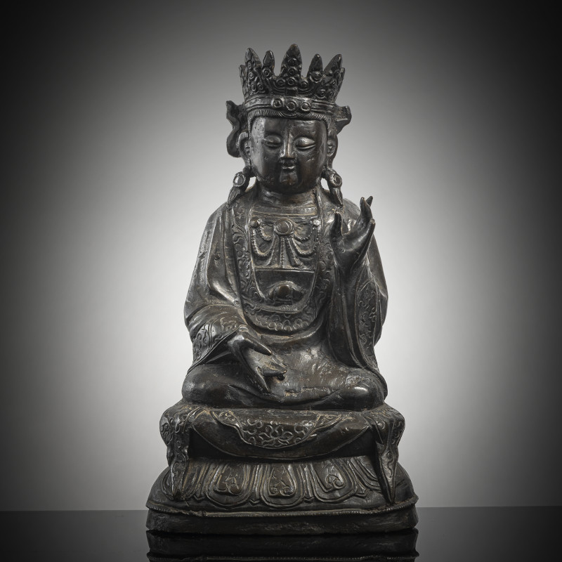 A bronze figure of a crowned Bodhisattva