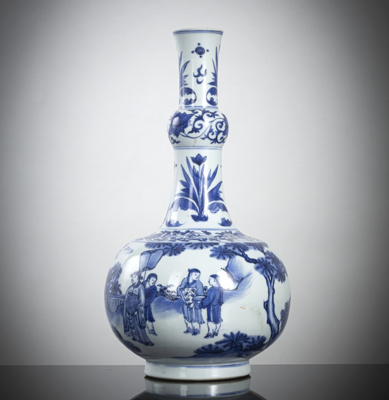 A fine porcelain bottle vase decorated in underglaze blue with a figural scene