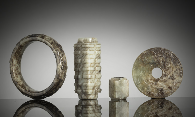 A group of eight jade carvings, some in archaic forms such as 'cong' etc.