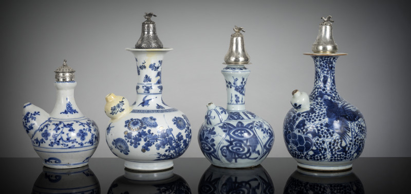 Four porcelain kendi decorated in underglaze blue, all with silver/metal lids