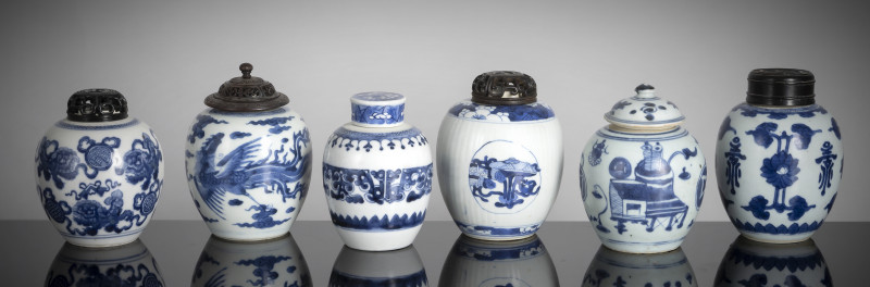 A group of six jars with underglaze blue decoration, some with wooden covers