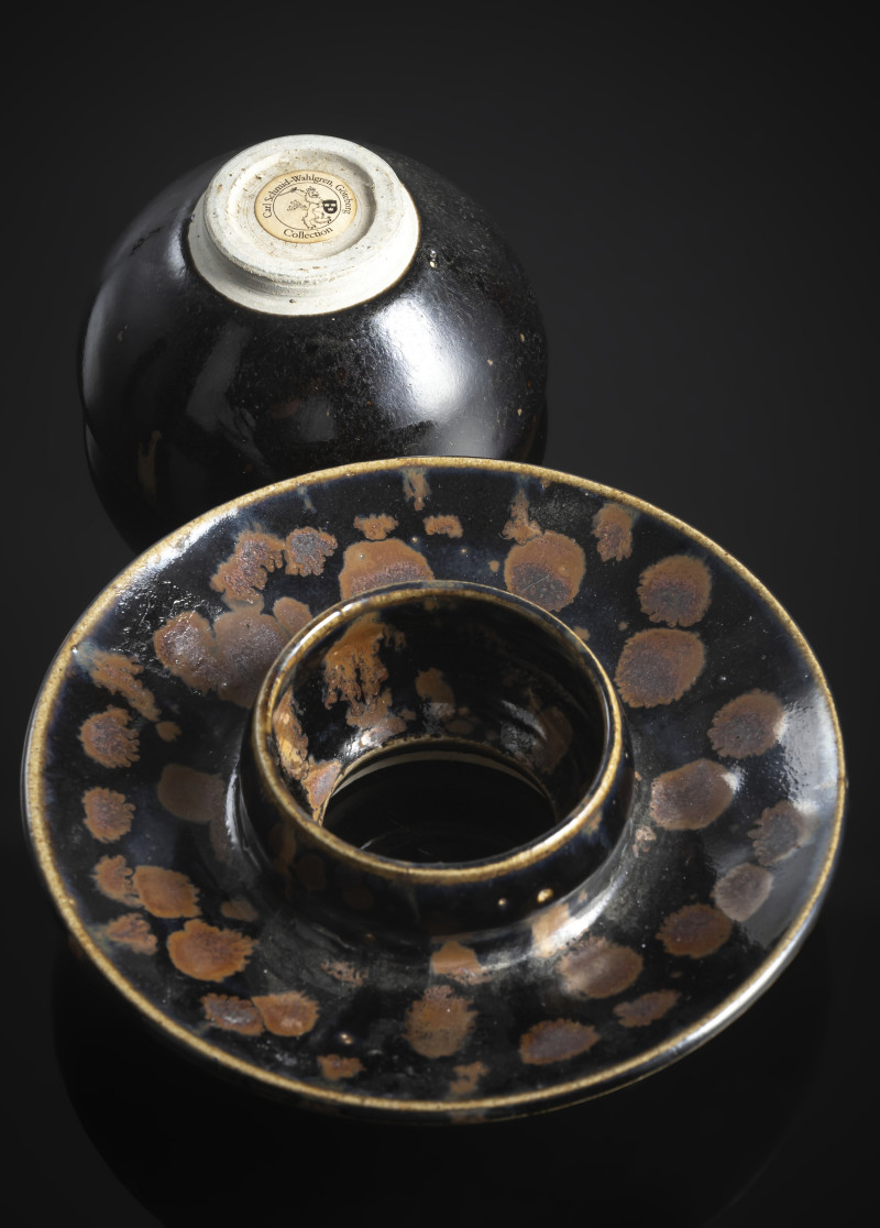 A black-glazed russet-splashed tea bowl on an associated base - 图3