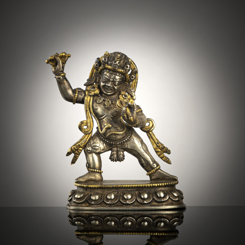 A parcel-gilt lilver figure of Vajrapani