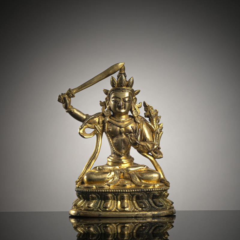 A GILT-BRONZE FIGURE OF MANJUSHRI