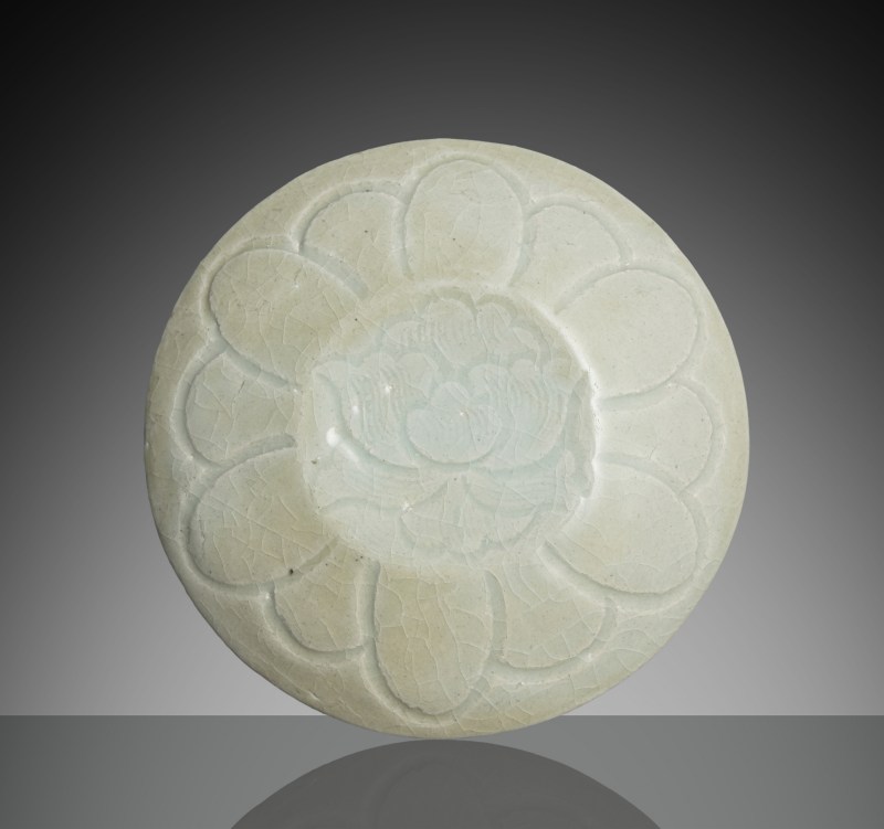 A 'qingbai' ware cosmetic box with peony decoration