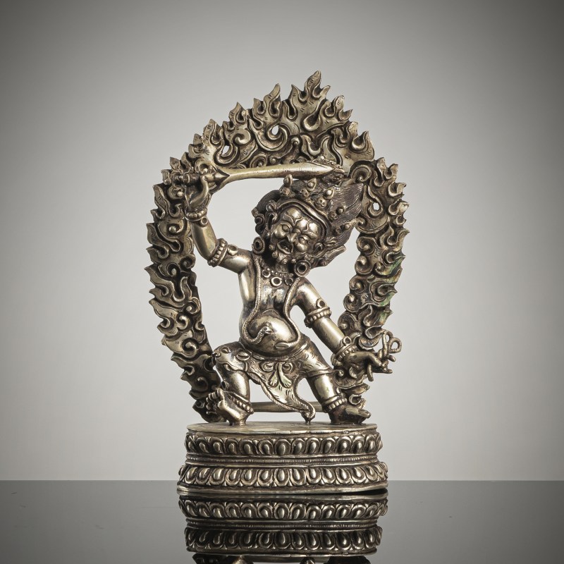 A SILVER FIGURE OF ACALA