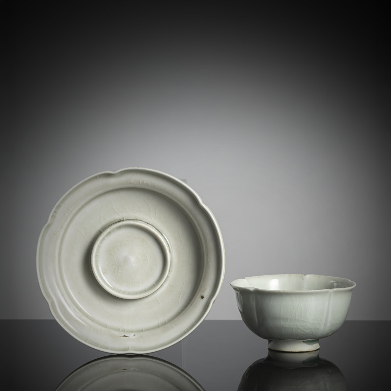 A floriform 'qingbai' ware tea cup and associated stand