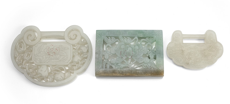 Two pendants and a belt clasp made of jade or jadeite