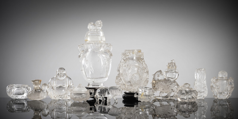 A group of eleven rock crystal and glass objects, including lidded vases/jars