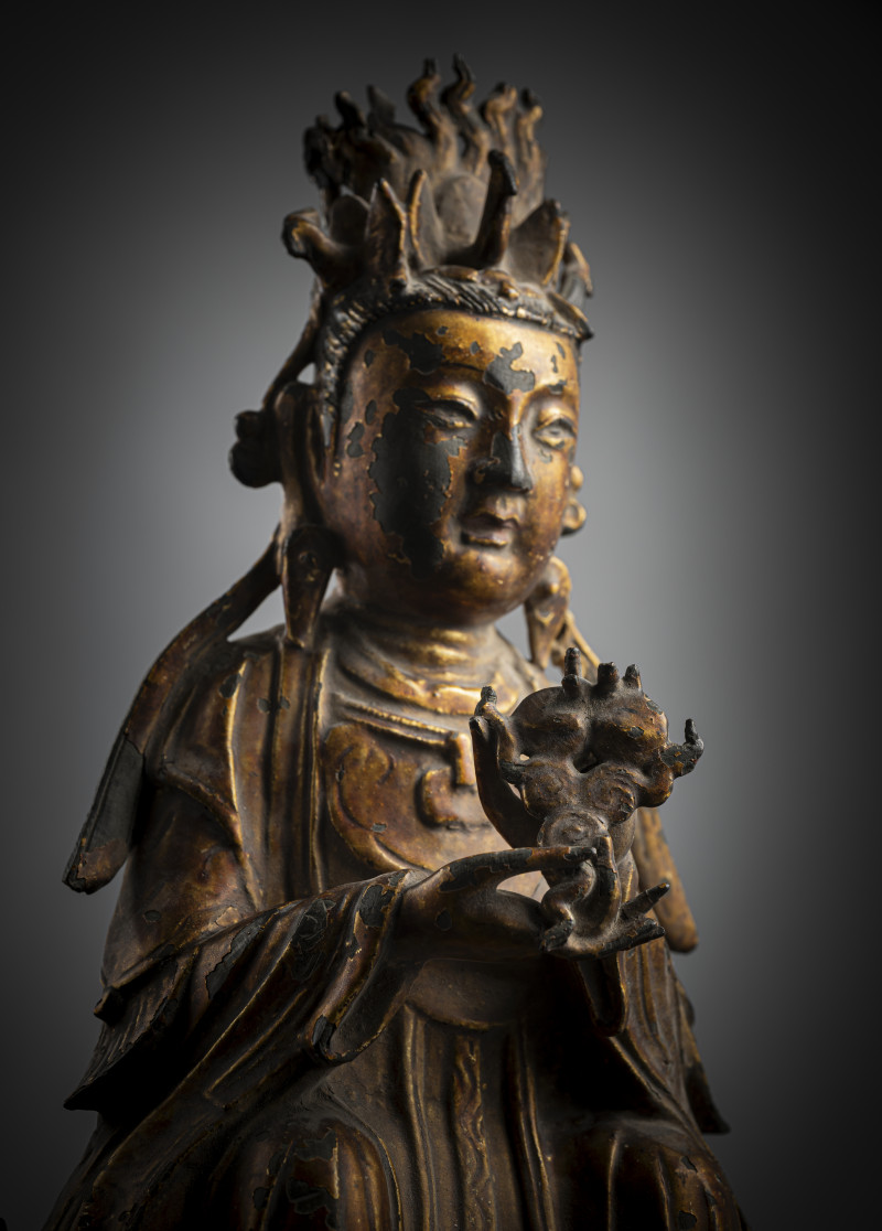 Bronze of Bixia with lacquer gilding depicted seated in a European posture