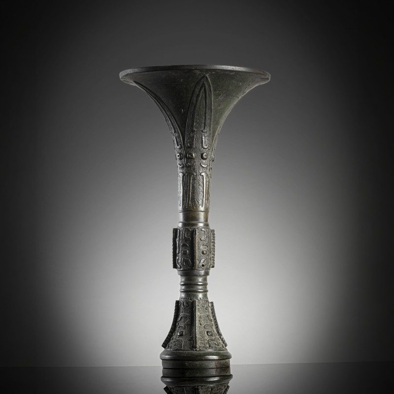 A bronze 'gu' vase with archaistic relief decoration