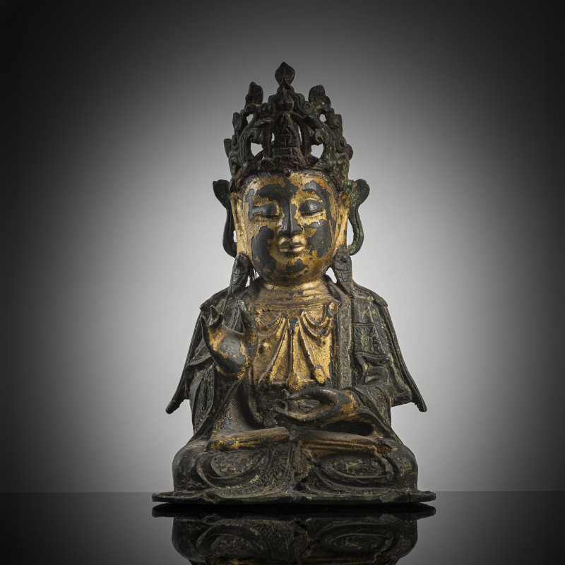A part-gilt bronze of seated Guanyin