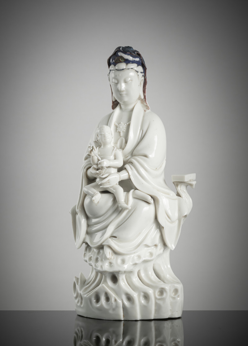 A dehua figure of a Guanyin and child