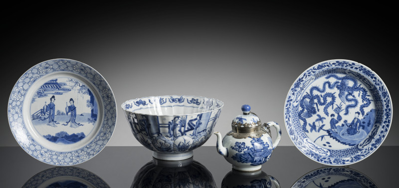 A group of four blue and ehite porcelains, including a teapot with silver mounting