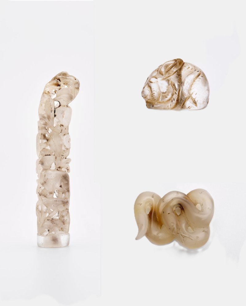 水晶鏤雕柄飾、玉髓蛇形珮及水晶兔形墜一組三件 | A ROCK CRYSTAL 'MYTHICAL BEAST' CARVING, A CHALCEDONY 'SNAKE' PENDANT AND A ROCK CRYSTAL 'RABBIT' PENDANT