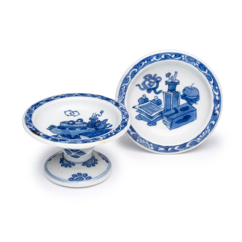 A pair of Chinese blue and white salts with antiquities design