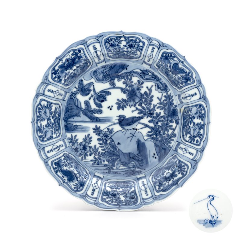 A Chinese blue and white plate with birds in a landscape