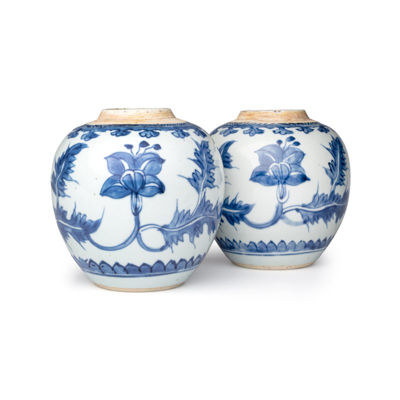A pair of Chinese blue and white jars with floral design