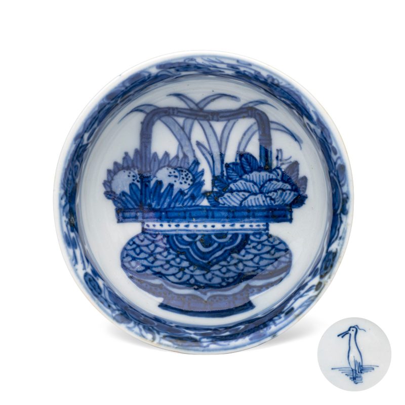 A rare Chinese blue and white 'Flower Basket' shallow bowl
