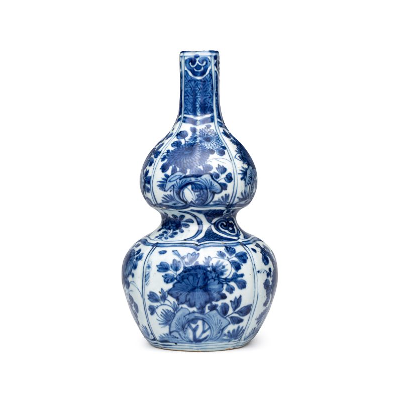 A Chinese blue and white double-gourd vase with floral design