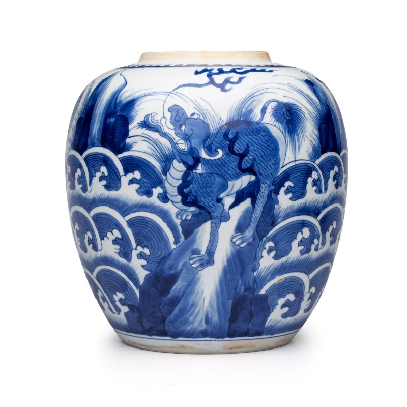 A pair of Chinese blue and white 'Mythical Beast' jars with later wooden covers and stands - 图18