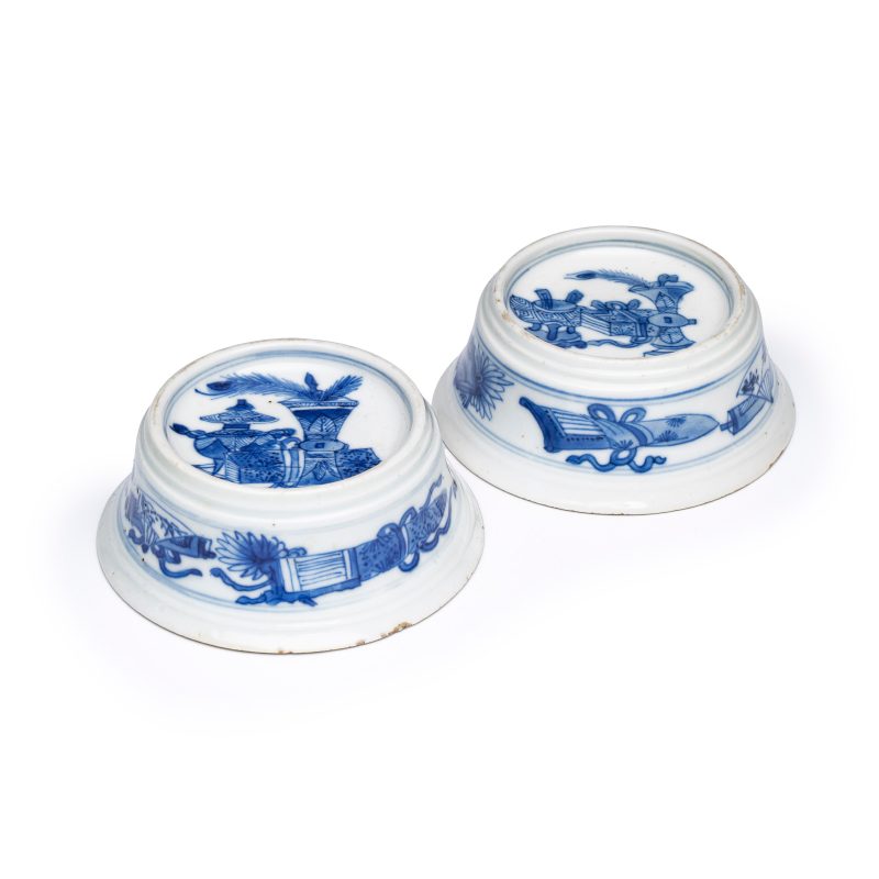 A pair of Chinese blue and white salt trenchers with antiquities design