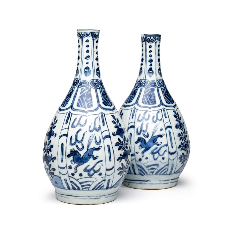 A pair of Chinese blue and white 'Flying Horses' pear-shaped bottle vases