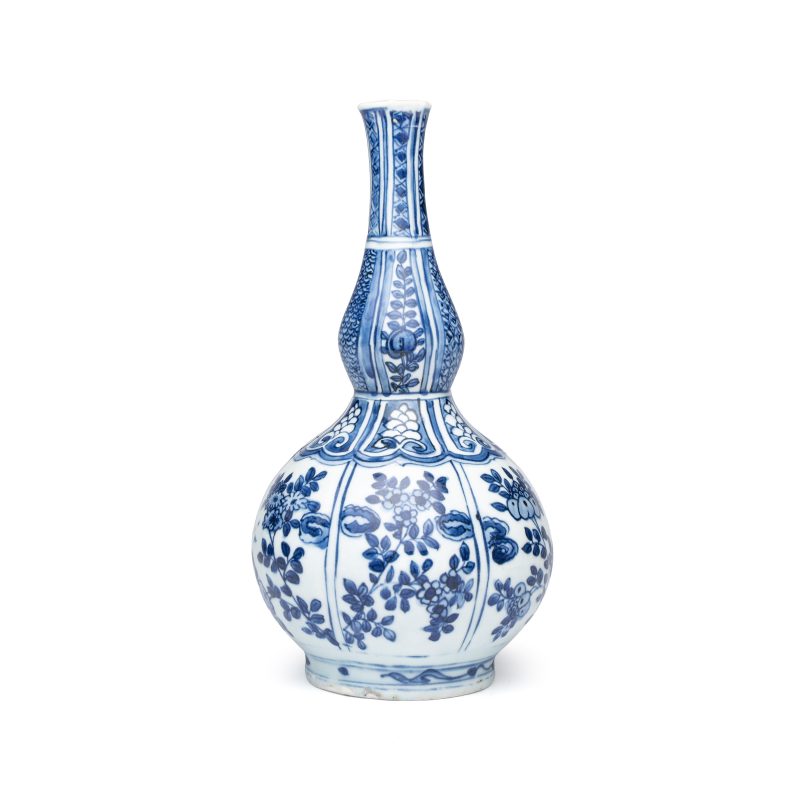 A Chinese blue and white double-gourd vase with floral design