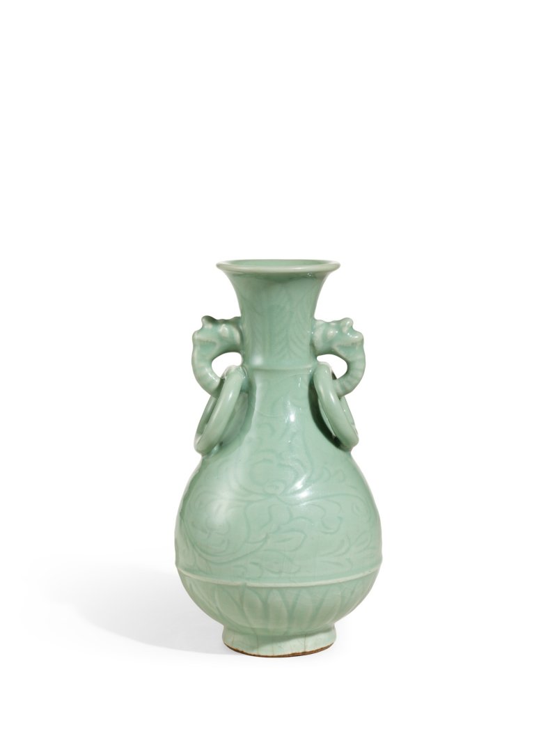 An heirloom Longquan celadon 'peony' handled vase, Ming dynasty | 明　龍泉青釉刻牡丹紋獸耳銜環瓶 - 图1