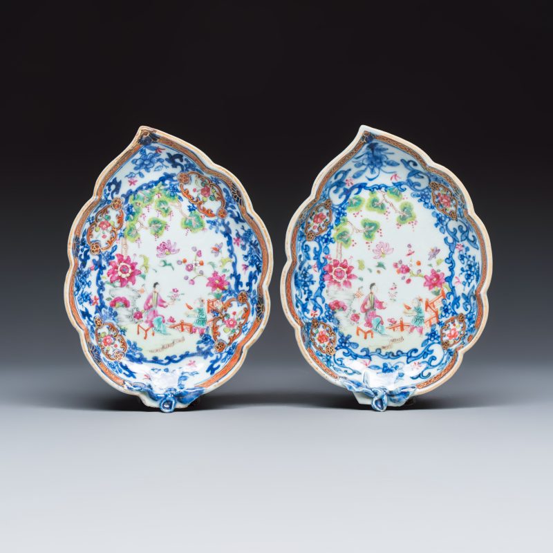 A pair of Chinese famille rose leaf-shaped saucers with figural design