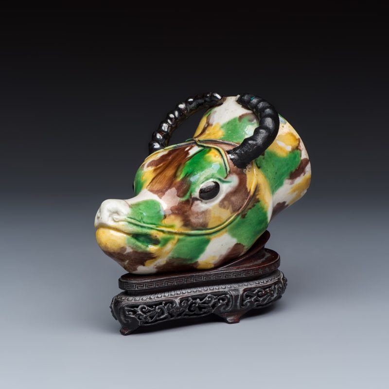 A Chinese famille verte sancai biscuit rhyton or libation cup in the shape of a buffalo head