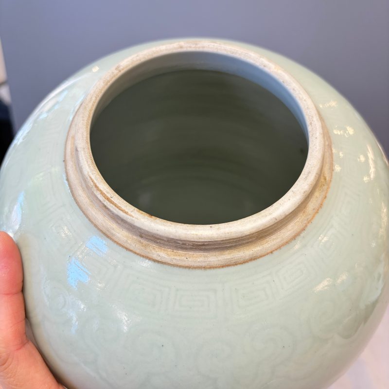A Chinese celadon-glazed covered vase with floral relief design - 图13