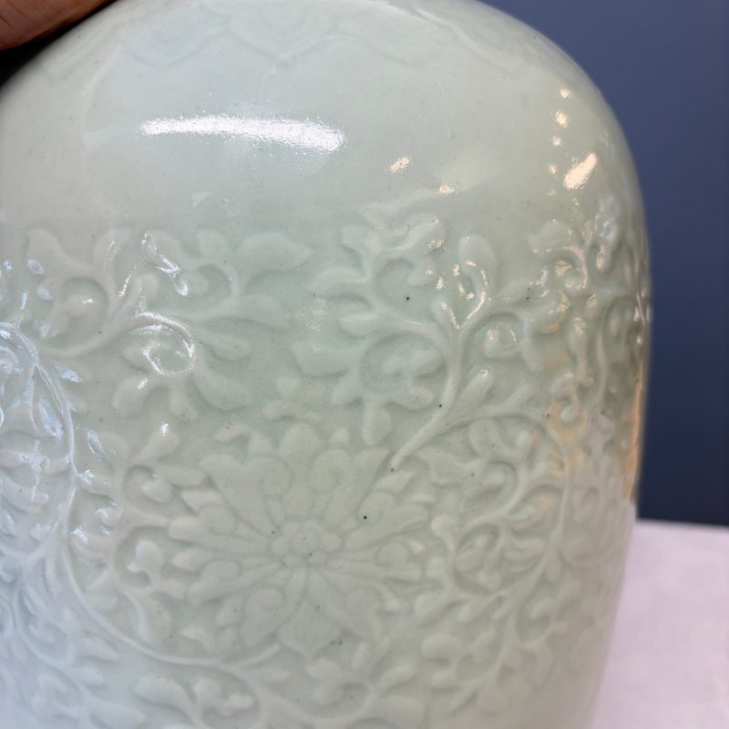 A Chinese celadon-glazed covered vase with floral relief design - 图14