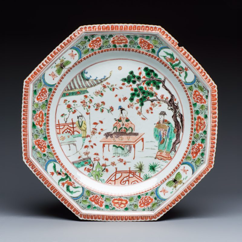 An unusual large octagonal Chinese famille verte dish with a lady playing the qin