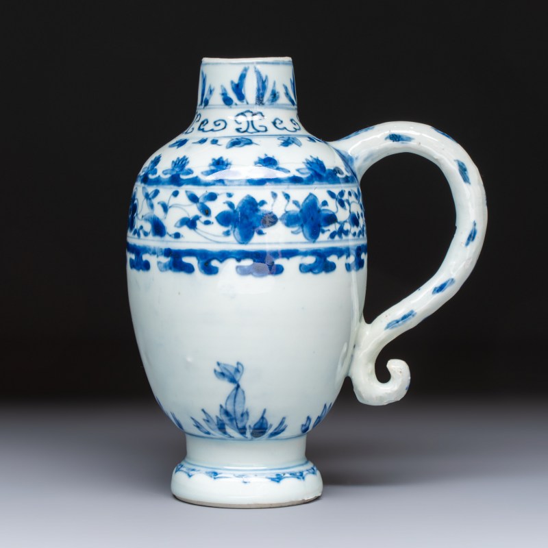 A Chinese blue and white jug with floral design