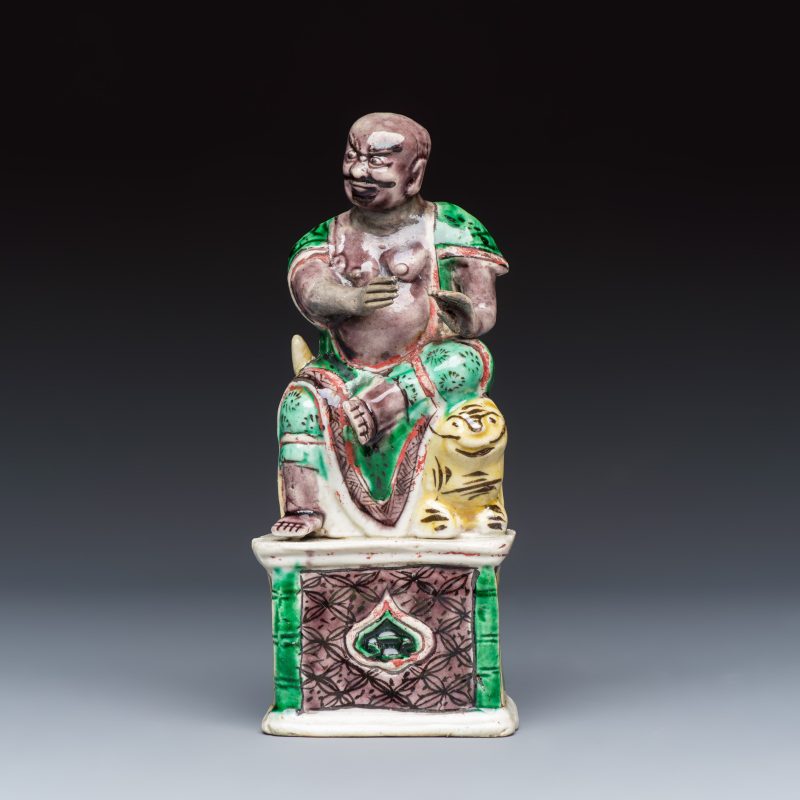 A Chinese famille verte sancai biscuit model of a seated Luohan on a tiger - 图2
