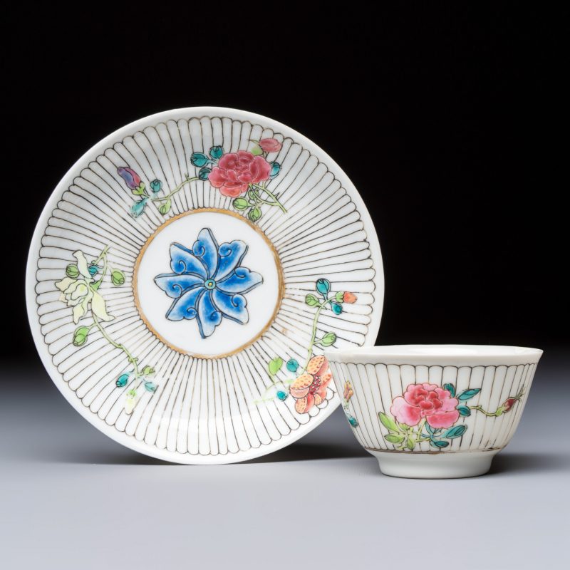 A Chinese famille rose tea bowl and saucer with floral design