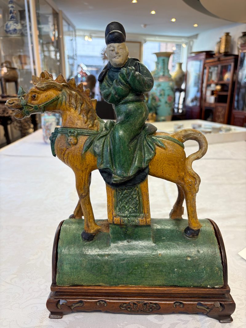 A pair of Chinese sancai-glazed stoneware 'Horseriders' roof tiles on later wooden stands - 图27